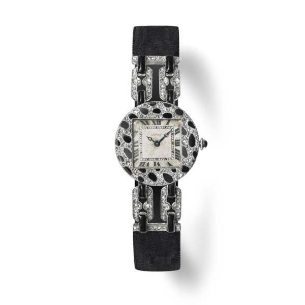 Panther-skin-wristwatch.-Cartier-Paris-1914.-Onyx-diamonds-pink-gold-platinum-and-black-moire-strap.-Nils-Herrmann-Collection-Cartier-©-Cartier_result