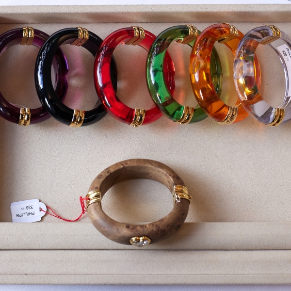 A wood bangle set (lot 338) with heart-shaped diamond