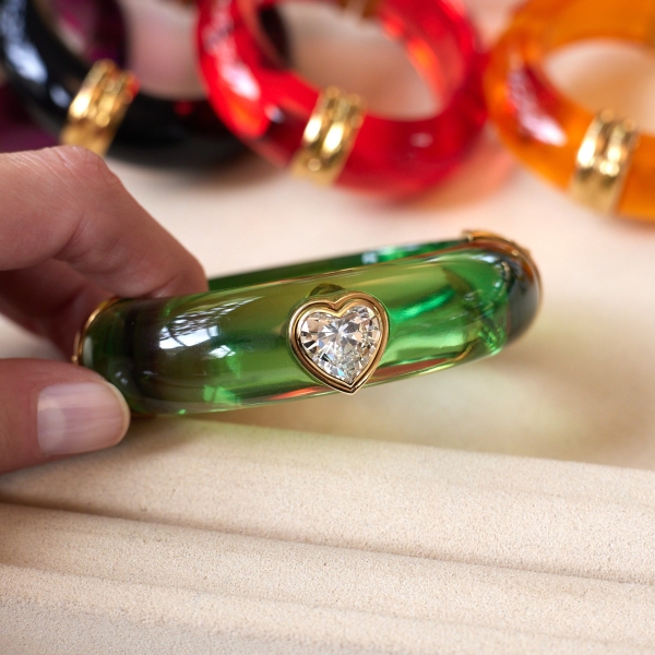 Acrylic bangle set (lot 338) with heart-shaped diamond