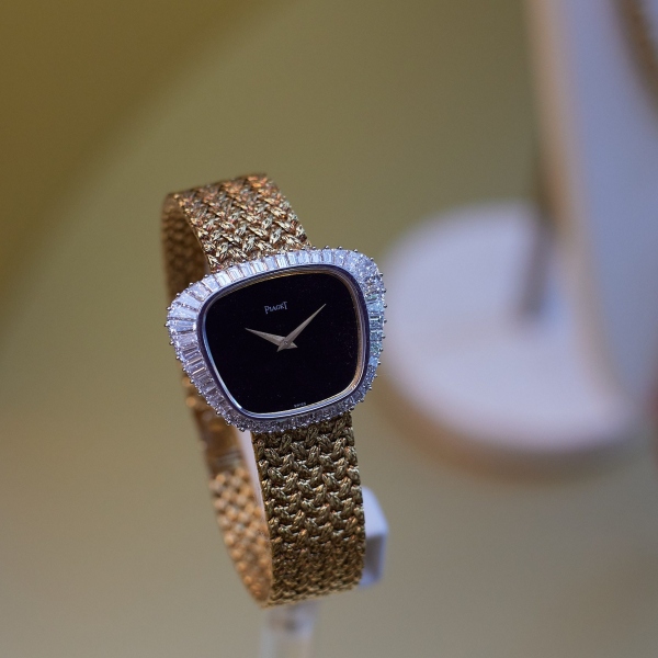 Piaget yellow gold watch with diamonds and onyx